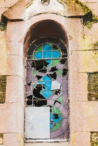 Broken window in old building